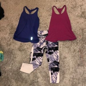 2 under aurmor tank tops and a pair of leggings